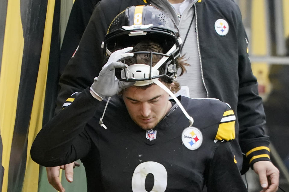 Pittsburgh Steelers quarterback Kenny Pickett (8) walks to the locker room after being injured during the first half of an NFL football game against the Arizona Cardinals in Pittsburgh, Sunday, Dec. 3, 2023. (AP Photo/Gene J. Puskar)