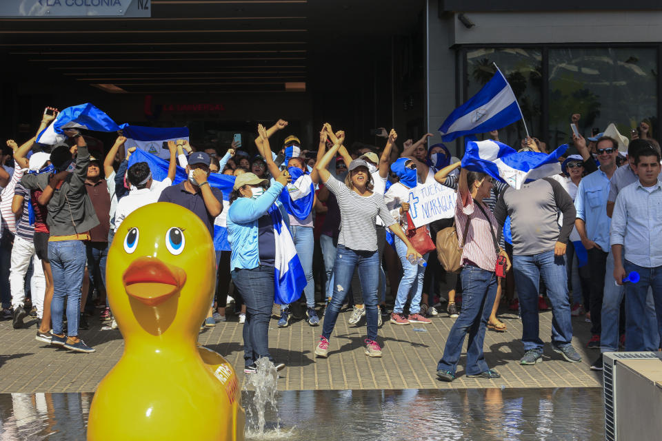 Demonstrators chant during a protest demanding the government release hundreds of protesters held in custody since 2018, in Managua, Nicaragua, Saturday, March 16, 2019. Nicaragua's government banned opposition protests in September and police broke up Saturday's attempt at a demonstration. (AP Photo/Alfredo Zuniga)