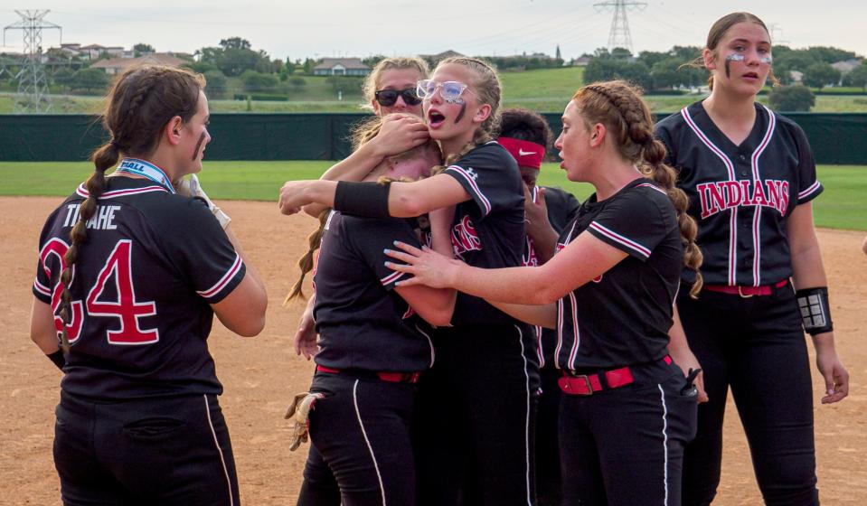 The Fort White players comfort each other after losing a close game to Jay High School at the Class 1A state finals at Legends Way Ballfields in Clermont on Wednesday, May 25, 2022.