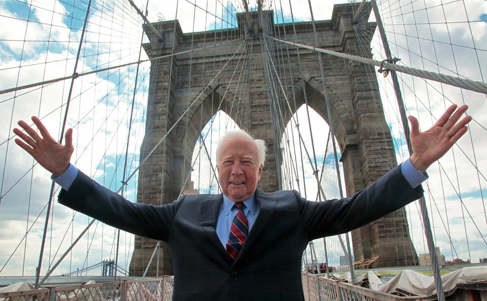 In this May 10, 2012 photo, author David McCullough, two-time Pulitzer Prize winner for books "Truman" and "John Adams," gestures as he walks over the Brooklyn Bridge in New York. McCullough is celebrating the 40th anniversary of his book "The Great Bridge," which has just been reissued with a new introduction by the 78-year-old writer. (AP Photo/Bebeto Matthews)