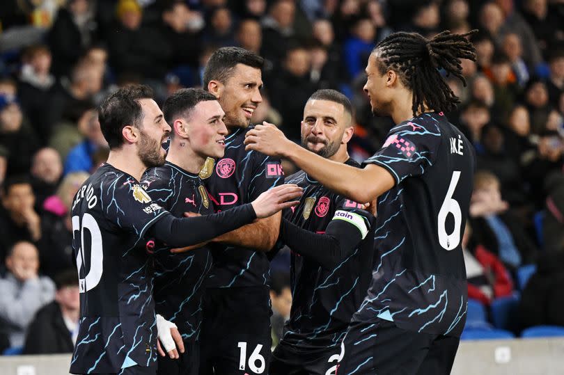 Phil Foden celebrates with his Manchester City teammates