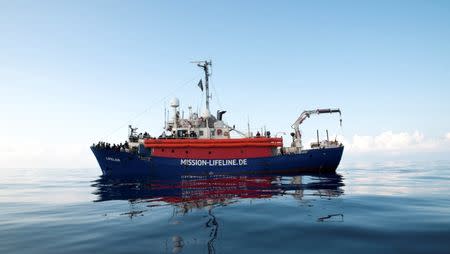 Migrants are seen on the deck of the Mission Lifeline rescue boat in the central Mediterranean Sea, June 21, 2018. Picture taken June 21, 2018. Hermine Poschmann/Misson-Lifeline/Handout via REUTERS