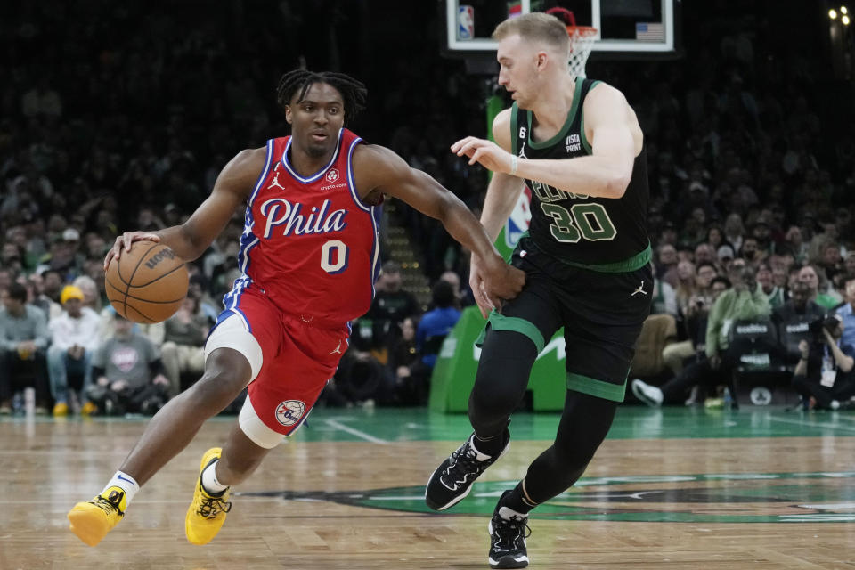 Philadelphia 76ers guard Tyrese Maxey (0) drives to the basket against Boston Celtics forward Sam Hauser (30) during the first half of Game 1 in the NBA basketball Eastern Conference semifinals playoff series, Monday, May 1, 2023, in Boston. (AP Photo/Charles Krupa)