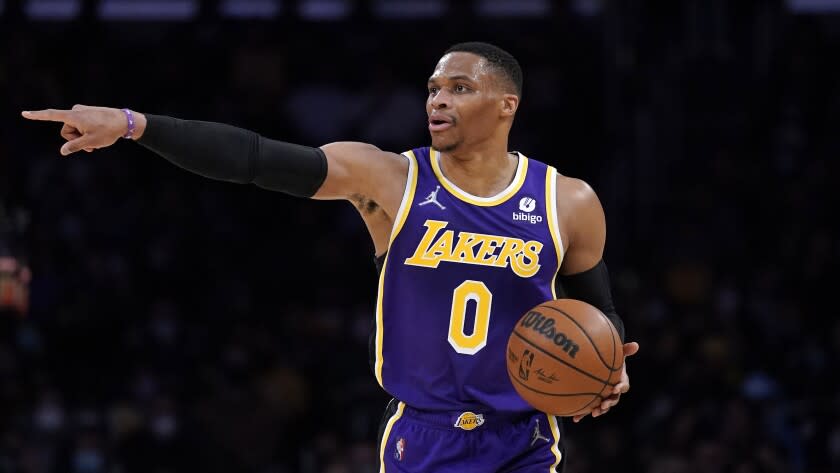 Los Angeles Lakers guard Russell Westbrook dribbles during the first half of an NBA basketball game.