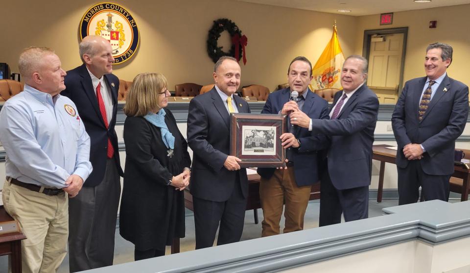 John Bonanni, fourth from left, is honored by Morris County Board of County Commissioners Board members at their last meeting of the year. Bonanni is retiring after  33 years in county government, the last 18 serving as county administrator.