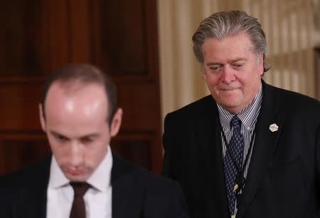 White House Chief Strategist Steve Bannon (R) arrives with Senior Advisor Stephen Miller (L) a for a news conference by U.S. President Donald Trump at the White House in Washington, U.S., February 16, 2017. REUTERS/Carlos Barria