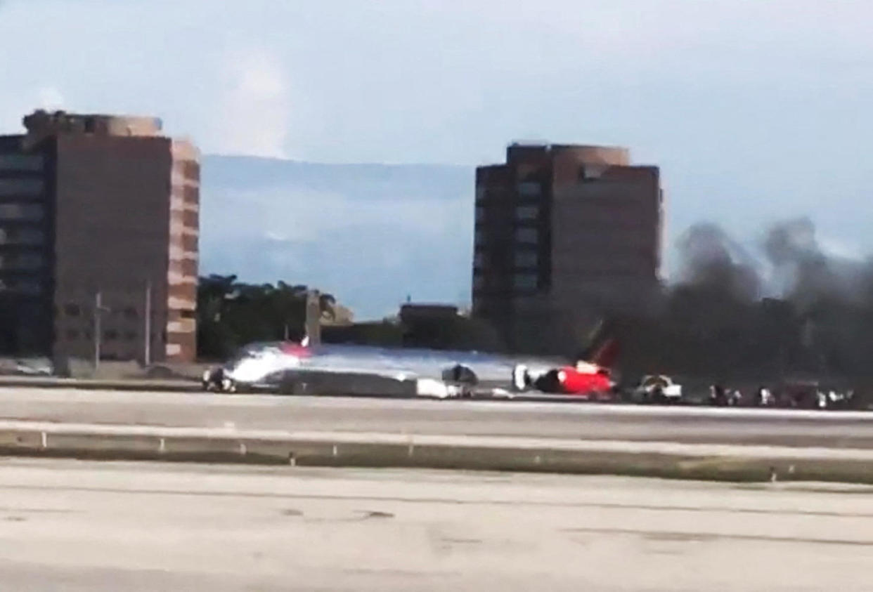 A video shows a plane at Miami International Airport after an emergency landing, in this screengrab obtained by Reuters from a social media video, June 21, 2022.  / Credit: REUTERS