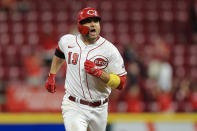 Cincinnati Reds' Joey Votto reacts as he runs the bases after hitting a two-run home run during the third inning of a baseball game against the Pittsburgh Pirates in Cincinnati, Monday, Sept. 20, 2021. (AP Photo/Aaron Doster)