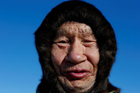 A herder of the agricultural cooperative organisation "Harp" takes part in the early voting in remote areas ahead of the presidential election, at a reindeer camping ground, about 250 km south of Naryan-Mar, in Nenets Autonomous District, Russia, March 4, 2018. REUTERS/Sergei Karpukhin
