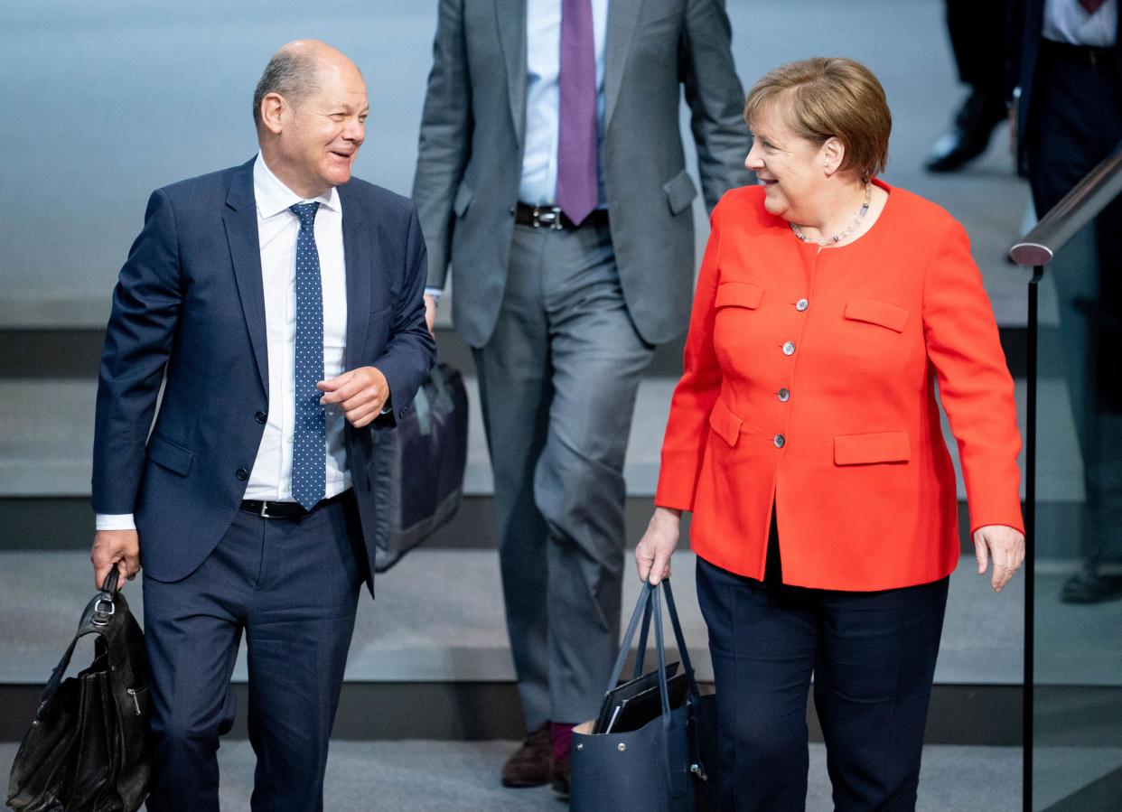 18 June 2020, Berlin: Chancellor Angela Merkel (CDU), and Olaf Scholz (SPD), Federal Minister of Finance, will attend the 166th session of the German Bundestag. Photo: Kay Nietfeld/dpa (Photo by Kay Nietfeld/picture alliance via Getty Images)