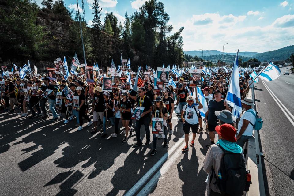 More than a thousand people march along highway 1 from Tel Aviv to Jerusalem