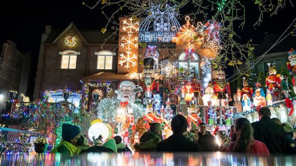 PHOTO: People visit the Dyker Heights Christmas Lights neighborhood on Dec. 12, 2021 in the Brooklyn. (Alexi Rosenfeld/Getty Images)