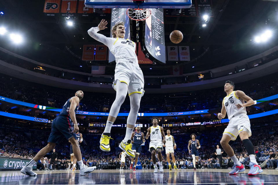 Utah Jazz's Lauri Markkanen, center, reacts to his dunk during the first half of the team's NBA basketball game against the Philadelphia 76ers, Saturday, Jan. 6, 2024, in Philadelphia. The Jazz won 120-109. (AP Photo/Chris Szagola)