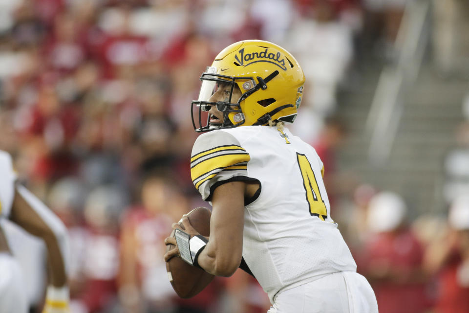 Idaho quarterback Gevani McCoy looks for a receiver during the first half of an NCAA college football game against Washington State, Saturday, Sept. 3, 2022, in Pullman, Wash. (AP Photo/Young Kwak)