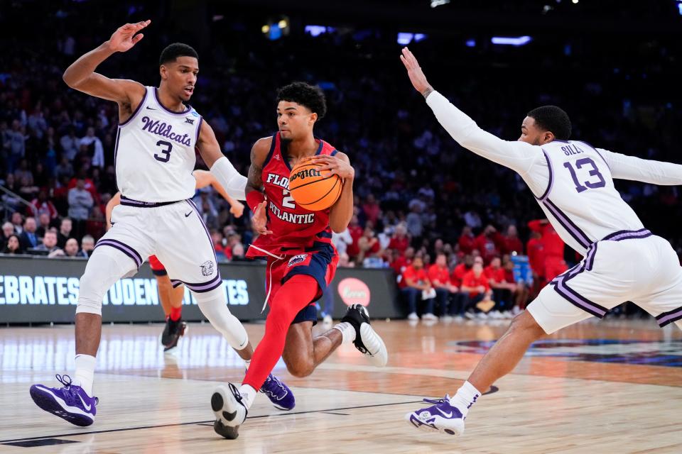 Mar 25, 2023; New York, NY, USA; Florida Atlantic Owls guard Nicholas Boyd (2) dribbles the ball as Kansas State Wildcats forward David N'Guessan (3) and Kansas State Wildcats guard Desi Sills (13) defend during the first half of an NCAA tournament East Regional final at Madison Square Garden. Mandatory Credit: Robert Deutsch-USA TODAY Sports