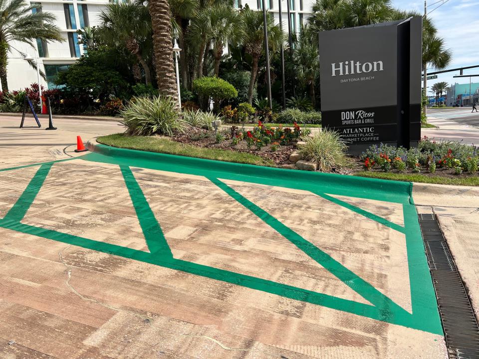 The green lines mark the spot of a mobile pick-up parking spot for the new Starbucks coffee shop at the Hilton Daytona Beach Oceanfront Resort, pictured Tuesday, Oct. 10, 2023. The coffee shop is now serving customers. It will hold its grand opening on Oct. 27 when a ribbon-cutting will be held at 10 a.m. with the Daytona Regional Chamber of Commerce. The new Starbucks is at the south end of the hotel on the northeast corner of A1A and Auditorium Boulevard.
