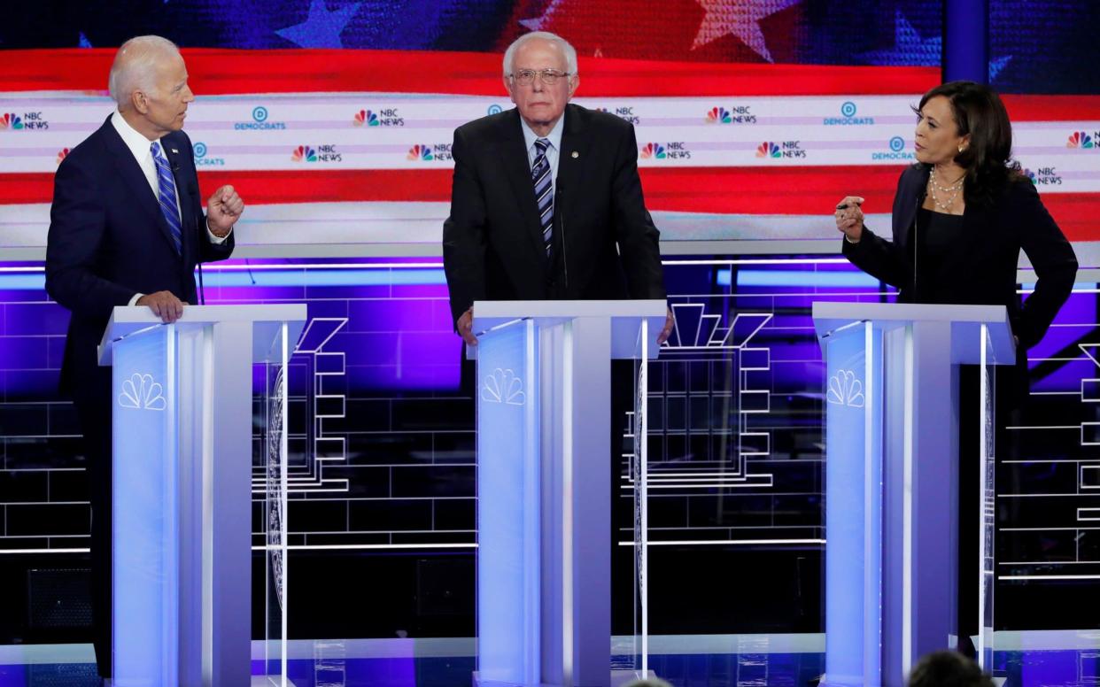 Joe Biden, left, and Kamala Harris, right, clashing in a debate in Miami between Democratic presidential hopefuls - REUTERS