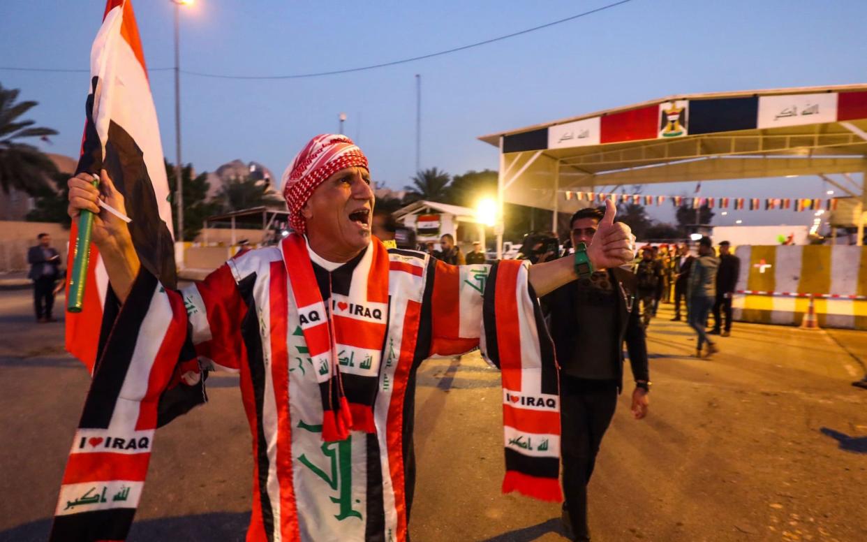 Iraqis celebrate the re-opening of the Green Zone, home to government buildings and Western embassies - AFP