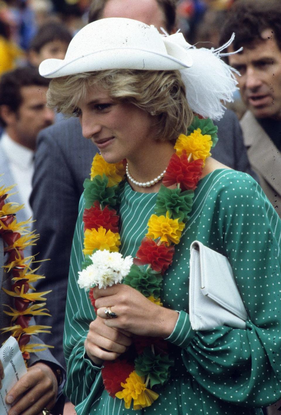 <p>Princess Diana wears a polka-dotted and striped dress for the welcome ceremony in Auckland, New Zealand. <br></p>