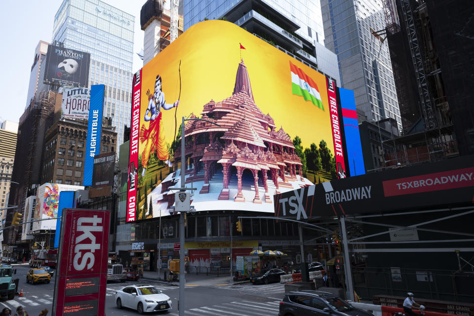 Imagery of the Hindu deity Ram and 3-D portraits of the proposed Hindu temple are displayed on a digital billboard in Times Square, Wednesday, Aug. 5, 2020, to celebrate the groundbreaking ceremony of a temple dedicated to the Hindu god Ram by Indian Prime Minister Narendra Modi in Ayodhya, in New Delhi, India. Hindus rejoiced as Modi broke ground on a long-awaited temple of their most revered god, Ram, at the site of a demolished 16th century mosque. (AP Photo/Mark Lennihan)