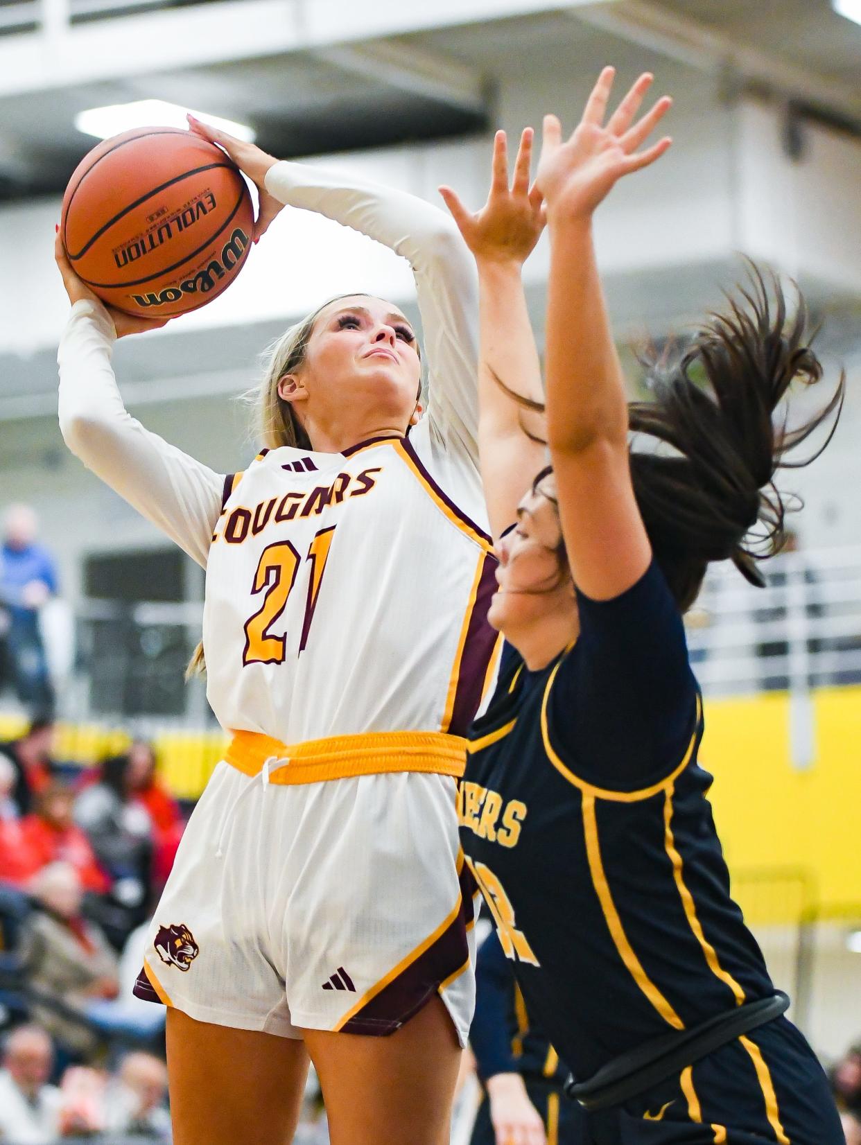 Bloomington North’s Ava Reitmeyer (21) attempts a shot against Mooresville’s Addi VanWanzeele during the IHSAA semi-final sectional game at Mooresville High School on Friday, Feb. 2, 2024.