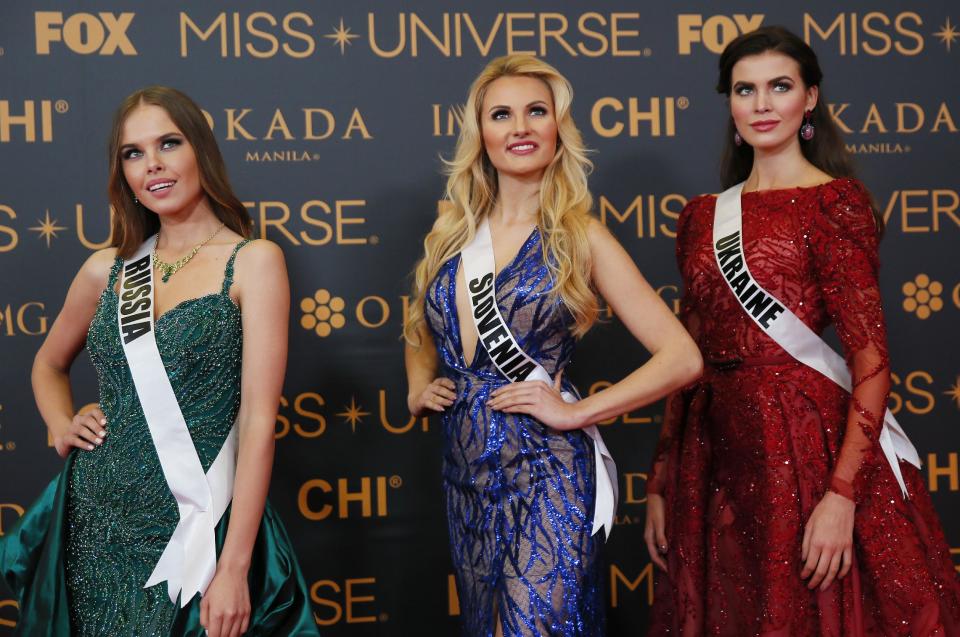 Miss Universe contestants pose on the red carpet on the eve of their coronation Sunday, Jan. 29, 2017, at the Mall of Asia in suburban Pasay city south of Manila, Philippines. Eighty-six conestants are vying for the title to succeed Pia Wurtzbach from the Philippines. From left, Yuliana Korolkova of Russia, Lucija Potocnik of Slovenia, Alena Spodynyuk of Ukraine.(AP Photo/Bullit Marquez)