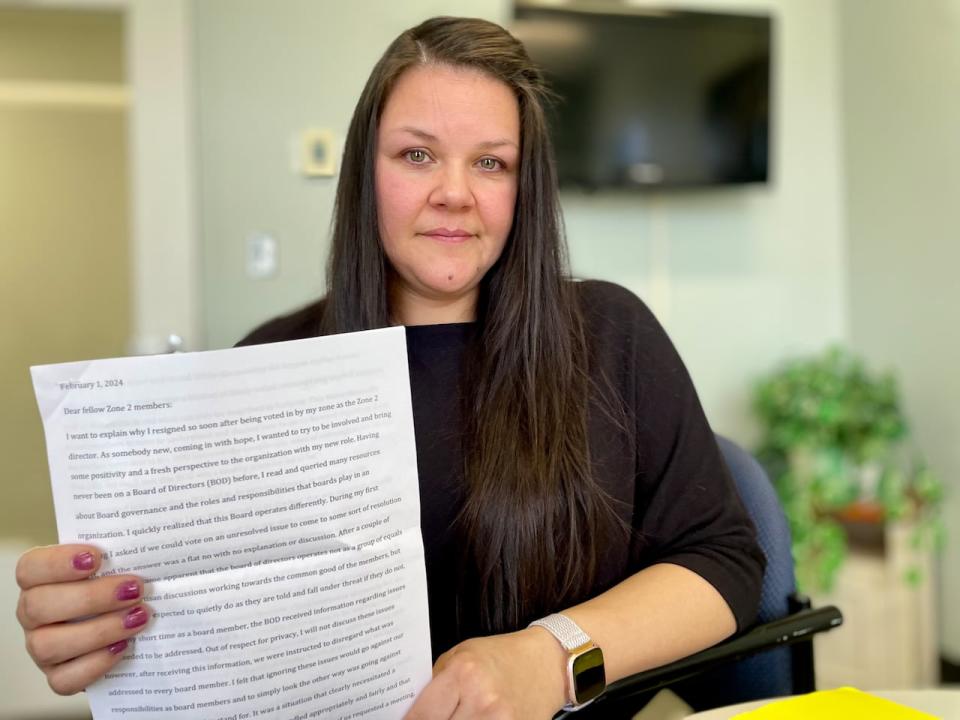 Mary Busch holds up a copy of the speech she read out at a Zone 2 members meeting in February, outlining her reasons for resigning from the Native Council of P.E.I.'s board of directors.   (Steve Bruce/CBC  - image credit)