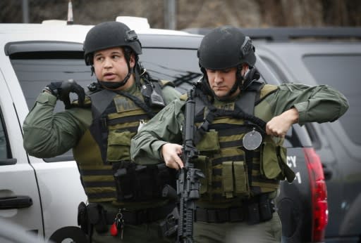 Hundreds of police from New Jersey and New York, including tactical officers armed with rifles and wearing olive-green fatigues, were deployed during the hours-long shootout in Jersey City