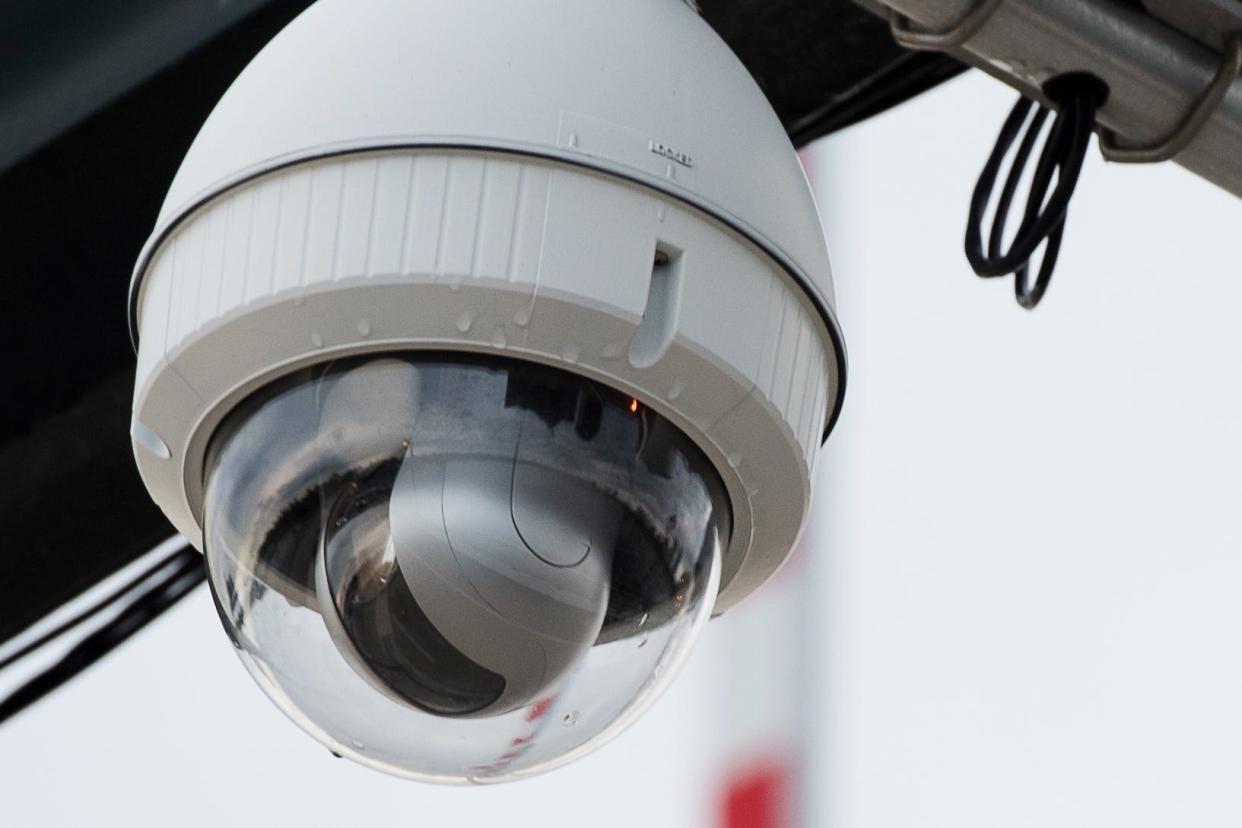 A video camera sits near a traffic light in the westbound lane on the Royal Park Bridge. The Town of Palm Beach Police Department manages more than 150 video cameras on the island. (Andres David Lopez / Daily News)