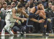 Nov 14, 2018; Milwaukee, WI, USA; Milwaukee Bucks forward Giannis Antetokounmpo (34) tries to steal the ball from Memphis Grizzlies guard Garrett Temple (17) in the fourth quarter at Fiserv Center. Benny Sieu-USA TODAY Sports