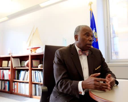 Milwaukee Commissioner of Health Bevan Baker speaks about lead poisoning from his office during a interview in Milwaukee, Wisconsin, U.S. November 30, 2016. REUTERS/Darren Hauck