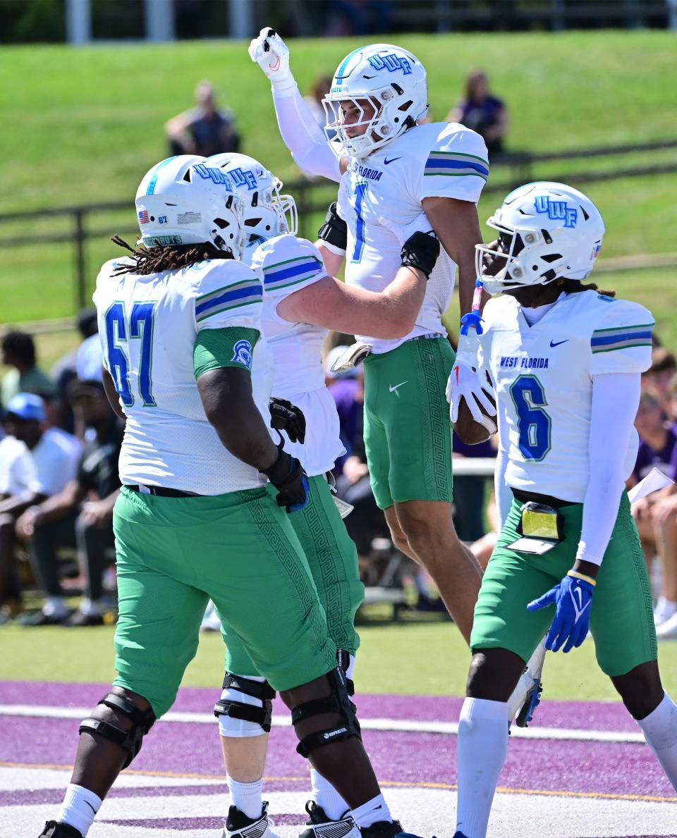 University of West Florida wide receiver Caden Leggett (1) is celebrated after a touchdown during the Argos' 35-3 win over McKendree University on Saturday, Sept. 9, 2023, at Leemon Field in Lebanon, Illinois.
