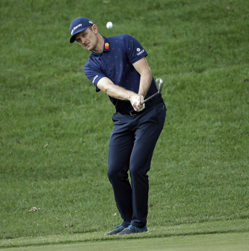 Justin Rose, of England, chips to the 15th green during the final round of the Wells Fargo Championship golf tournament at Quail Hollow Club in Charlotte, N.C., Sunday, May 5, 2019. (AP Photo/Chuck Burton)