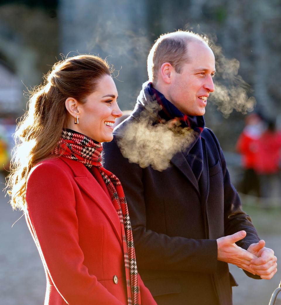 Britain's Prince William, Duke of Cambridge (R), and Britain's Catherine, Duchess of Cambridge (L) smile during a visit to Cardiff Castle in Cardiff in south Wales on December 8, 2020, on the final day of engagements on their tour of the UK. - During their trip, their Royal Highnesses hope to pay tribute to individuals, organisations and initiatives across the country that have gone above and beyond to support their local communities this year. (Photo by Jonathan Buckmaster / POOL / AFP) (Photo by JONATHAN BUCKMASTER/POOL/AFP via Getty Images)