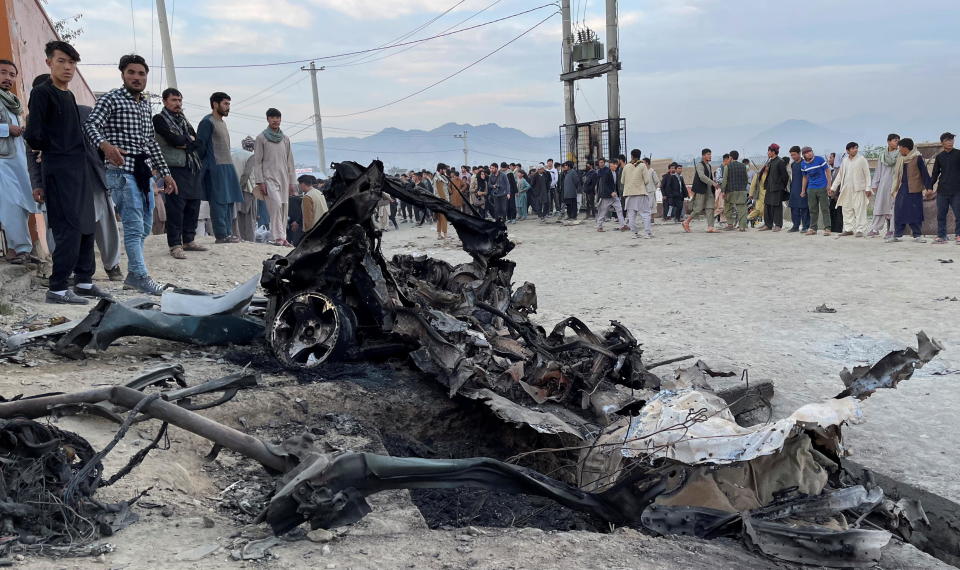 People at the site of a blast at a girls' school outside Kabul, Afghanistan on May 8, 2021. / Credit: STRINGER / REUTERS