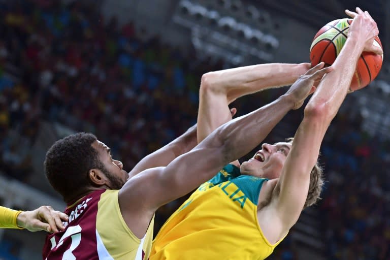 Australia's forward Ryan Broekhoff (R) is challenged by Venezuela's Nestor Colmenares during a Group A match at the Rio 2016 Olympic Games