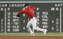 Boston Red Sox second baseman Vaughn Grissom throws to first for an out on Washington Nationals' Eddie Rosario during the sixth inning of a baseball game Friday, May 10, 2024, in Boston. (AP Photo/Mark Stockwell)