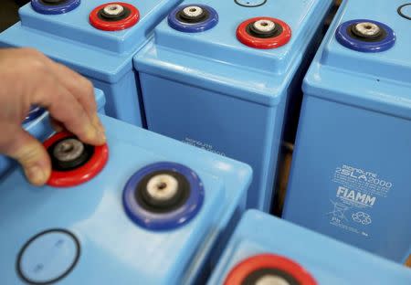 A worker prepares FIAMM batteries in this photo illustration taken at the battery maker's factory in Avezzano, near L'Aquila, November 28, 2014. REUTERS/Alessandro Bianchi