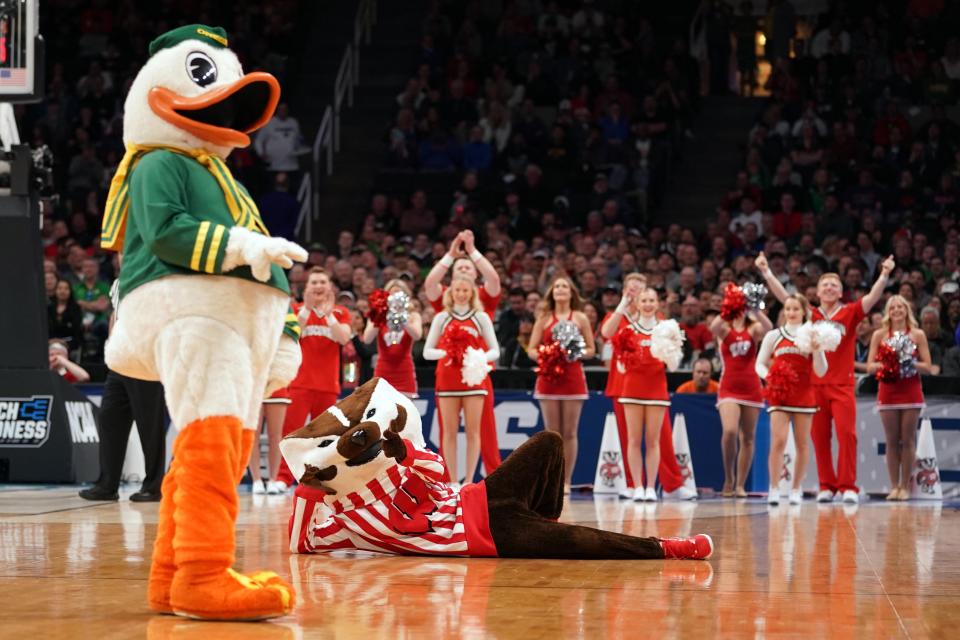 Puddles the Duck and Bucky the Badger entertain fans during a 2019 NCAA Tournament game.