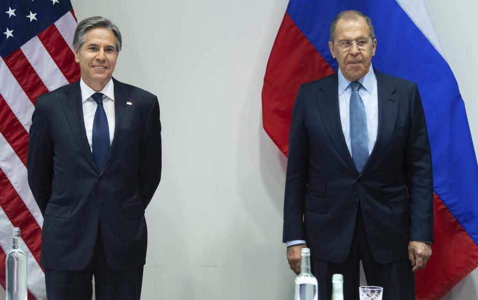 U.S. Secretary of State Antony Blinken, left, poses with Russian Foreign Minister Sergey Lavrov, right, before a meeting at the Harpa Concert Hall in Reykjavik, Iceland, Wednesday, May 19, 2021, on the sidelines of the Arctic Council Ministerial summit. (Saul Loeb/Pool Photo via AP)