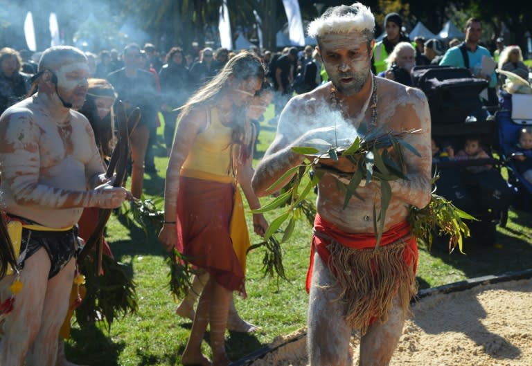 Indigenous Australian performers hold a smoking ceremony in Sydney on July 6, 2015, as senior Australian political figures met Aboriginal leaders to work towards "correcting" the constitution by recognising the nation's first indigenous inhabitants