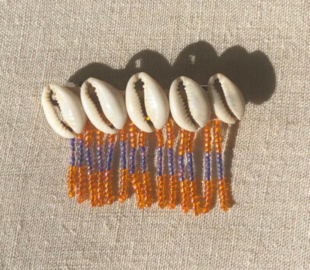 <p>Abacaxi Seashell Beaded Barette, $75, <a href="https://abacaxi-nyc.com/shop/shell-beaded-barrette" rel="nofollow noopener" target="_blank" data-ylk="slk:available here;elm:context_link;itc:0;sec:content-canvas" class="link ">available here</a>.</p>
