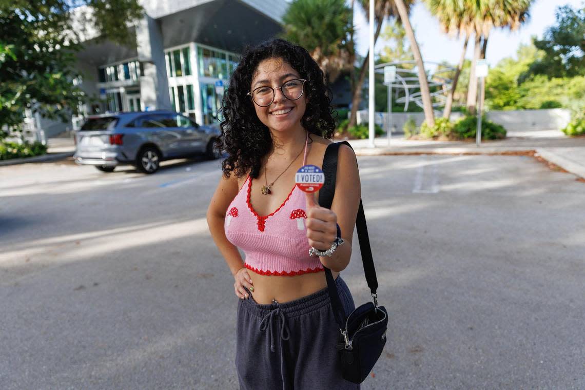 Nicole Montesinos, 23, poses with an “I Voted!” sticker after voting in the midterm elections in Miami-Dade County at the Aventura Branch Library on Tuesday, Nov. 8, 2022, in Aventura, Florida.