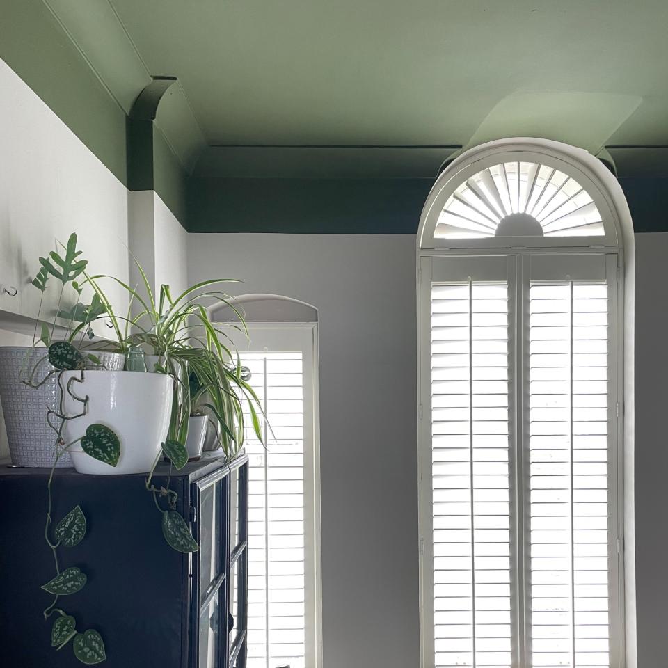 Green-painted ceiling in a bedroom