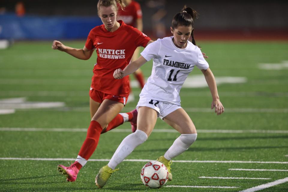 Framingham sophomore Lexi Sullivan steals the ball during the girls soccer game against Natick at Memorial Field in Natick on Sep. 19, 2023.