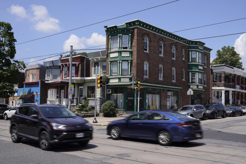 Traffic drives through an intersection near the scene of a fatal shooting spree, Thursday, July 6, 2023, in Philadelphia. (AP Photo/Matt Slocum)