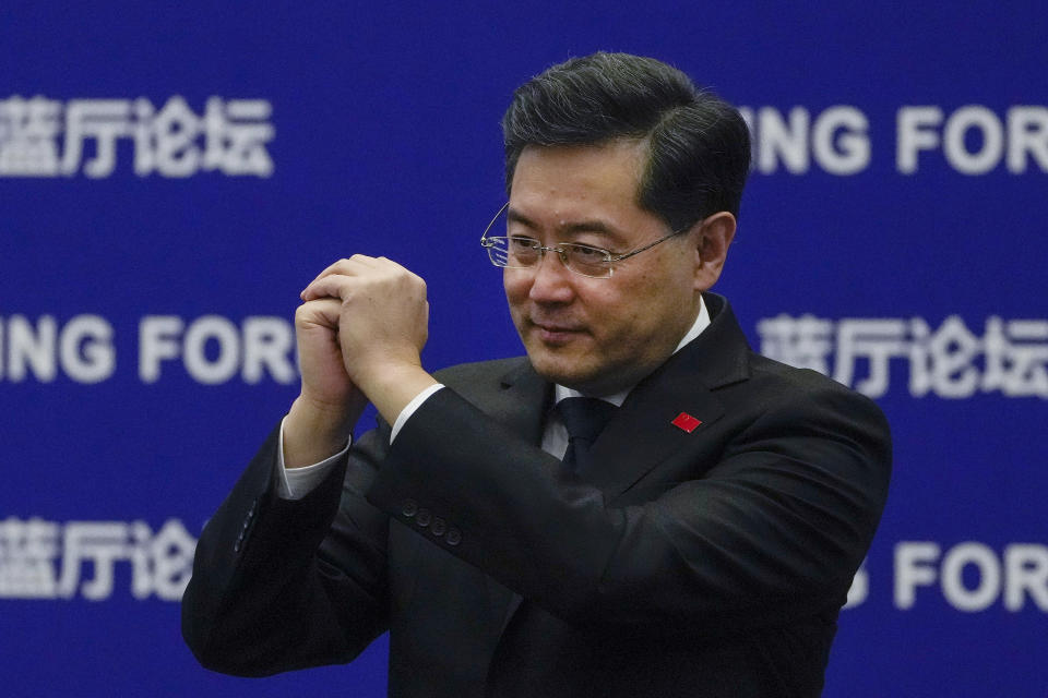 FILE - Chinese Foreign Minister Qin Gang gestures to delegations as he arrives at the Lanting Forum on the Global Security Initiative: China's Proposal for Solving Security Challenges held at the Ministry of Foreign Affairs office in Beijing, Feb. 21, 2023. China has removed outspoken foreign minister Qin Gang from office and replaced him with his predecessor, Wang Yi. In an announcement on Tuesday, July 25, 2023, state media gave no reason for Qin’s removal, but it comes after he dropped out of sight almost one month ago amid speculation over his personal affairs and political rivalries.(AP Photo/Andy Wong, File)
