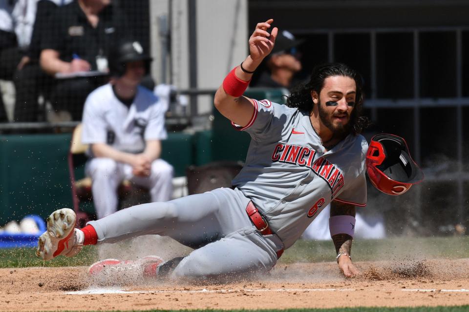 Jonathan India slides home during the Reds' five-run second inning. The Reds didn't score in the other eight innings and totaled only four hits for the game.