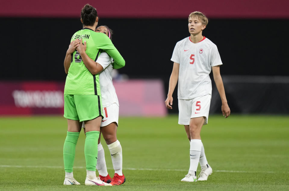 Canada's Quinn, right, leaves the field celebrate at the end of a women's soccer match against Chile at the 2020 Summer Olympics, Saturday, July 24, 2021, in Sapporo, Japan. Canada won 2-1.(AP Photo/Silvia Izquierdo)