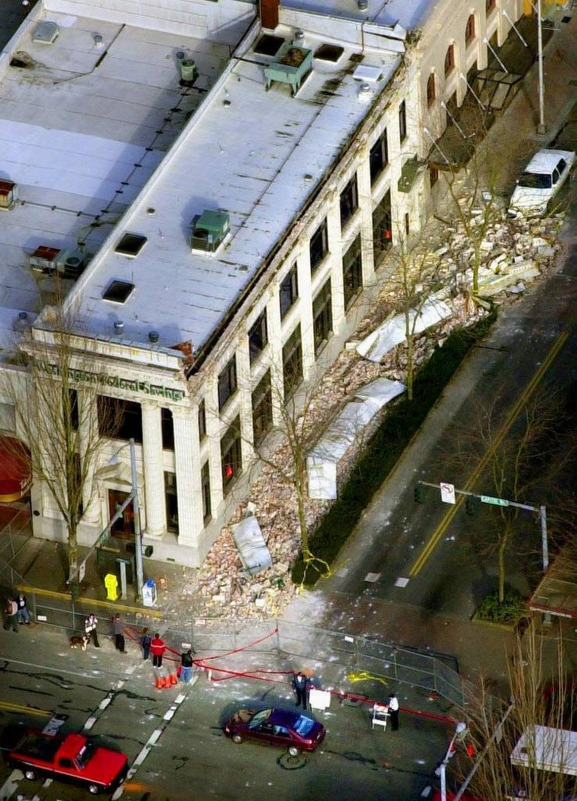 Rubble from the downtown Washington Federal Savings building rests on the sidewalk off Fifth Avenue in Olympia on Feb. 28, 2001 after a major earthquake rocked the region about 11 a.m.